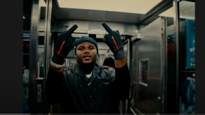 Tee Grizzley showing middle fingers