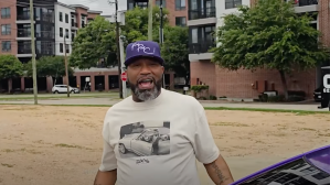 Bun B wearing purple hat