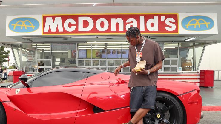 Travis Scott Fan Attempts To Buy His Jordans Right Off His Feet