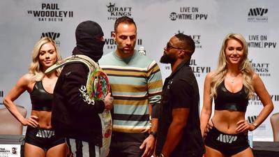 Jake Paul Attempts To Intimidate Tyron Woodley During Pre-Fight Staredown
