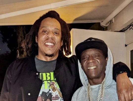 Icons: Flavor Flav Runs Into JAY-Z While He is in a Public Enemy Shirt