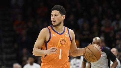 Devin Booker Calls Fan A "P*ssy" While Dribbling Up The Court: Watch