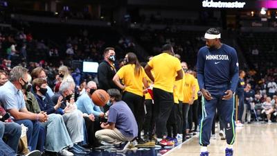 Fan Protests T-Wolves By Gluing Herself To The Court: Watch